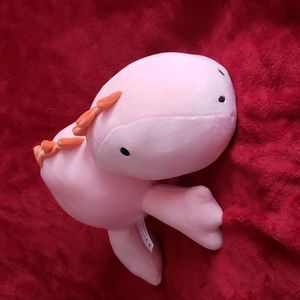 Pink plush dinosaur stuffed animal